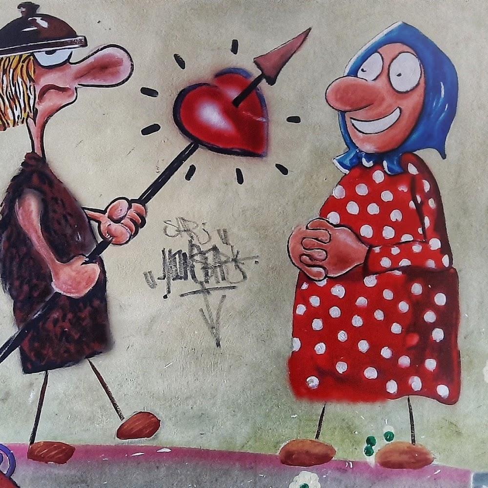 A cartoon man aiming an arrow at a red heart towards a woman.